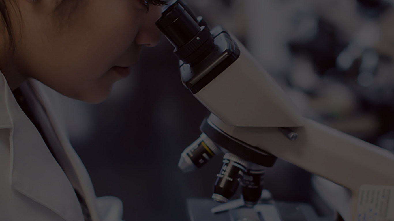 Girl looking in a microscope